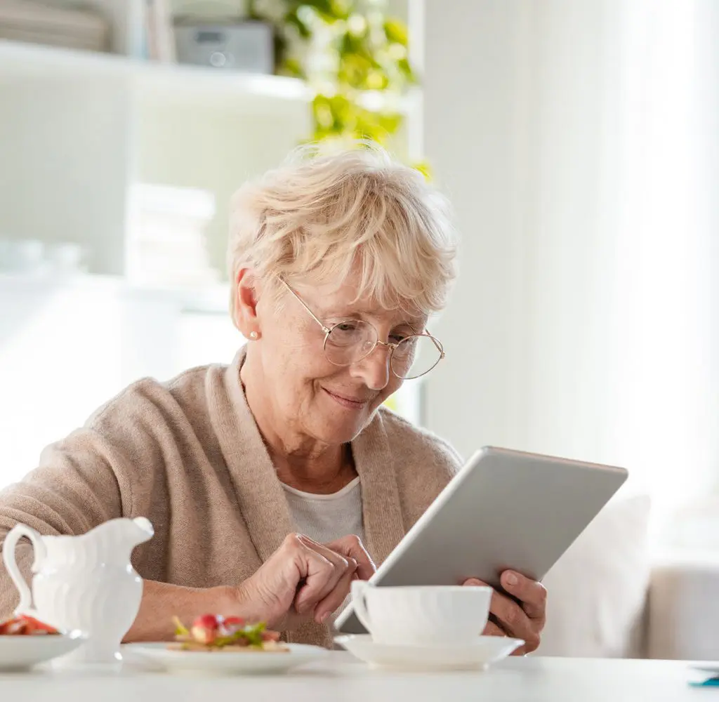 Senior Aged Woman using her Tablet Senior Aged Woman using her Tablet
