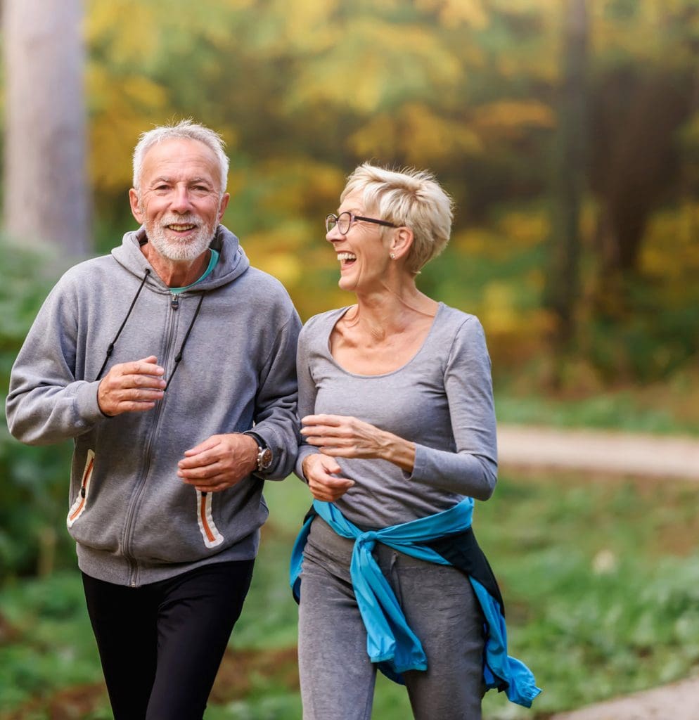 Two retired seniors taking a brisk walk around Peter Becker Community Two retired seniors taking a brisk walk around Peter Becker Community