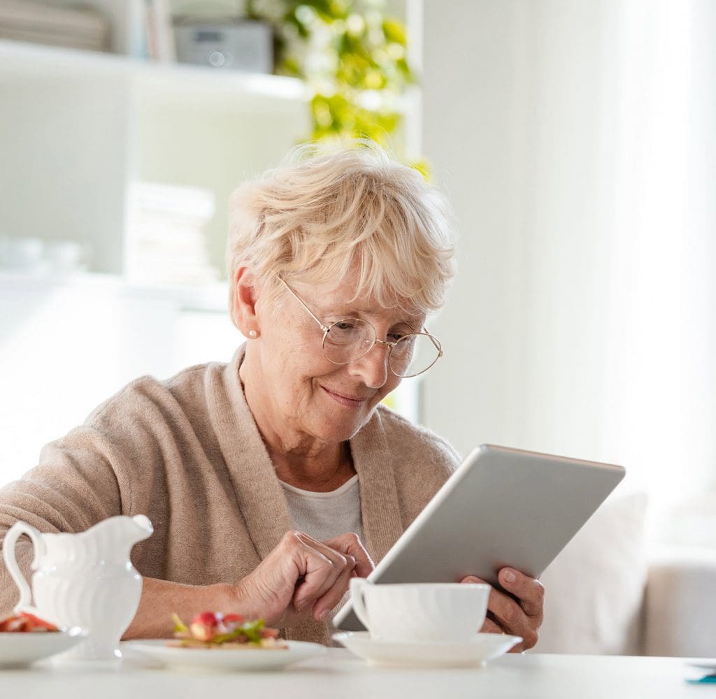 Senior Aged Woman using her Tablet