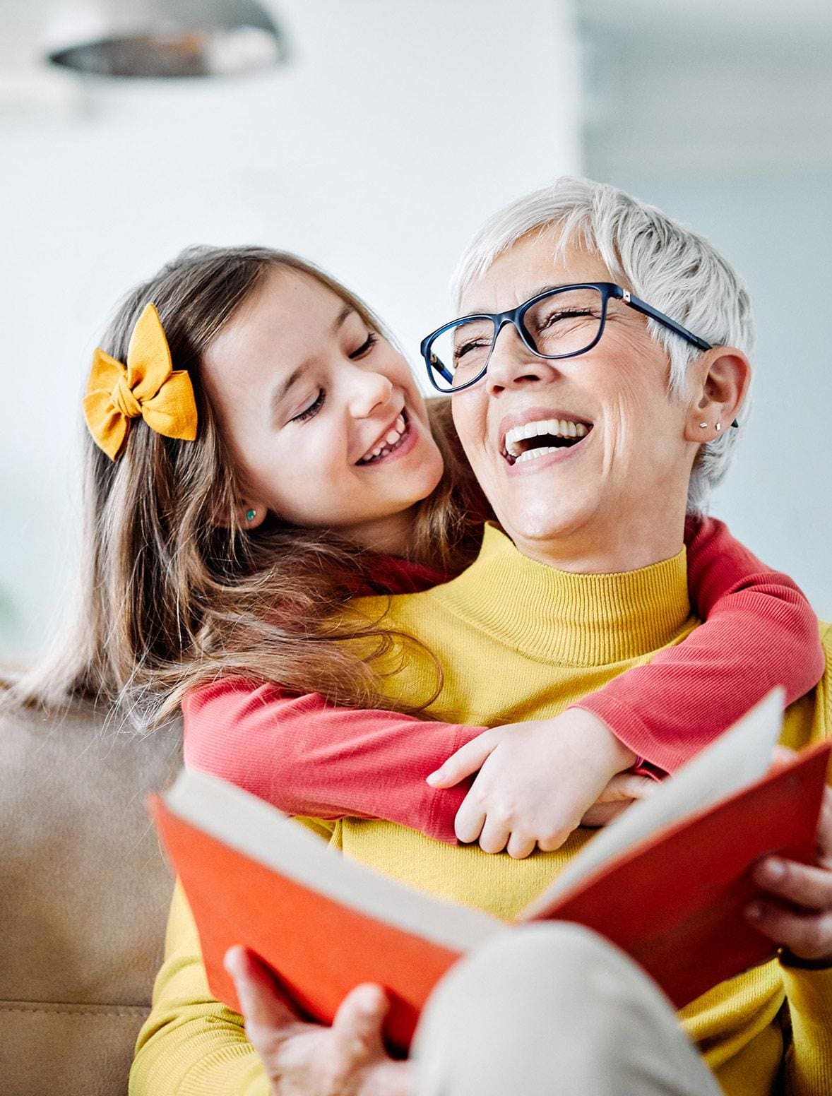 Older adult woman with granddaughter Older adult woman with granddaughter