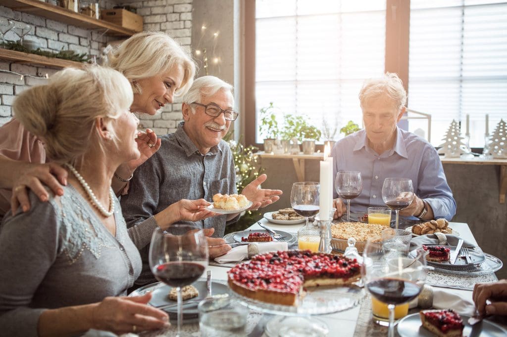 Four Peter Becker Community residents enjoying a holiday meal together