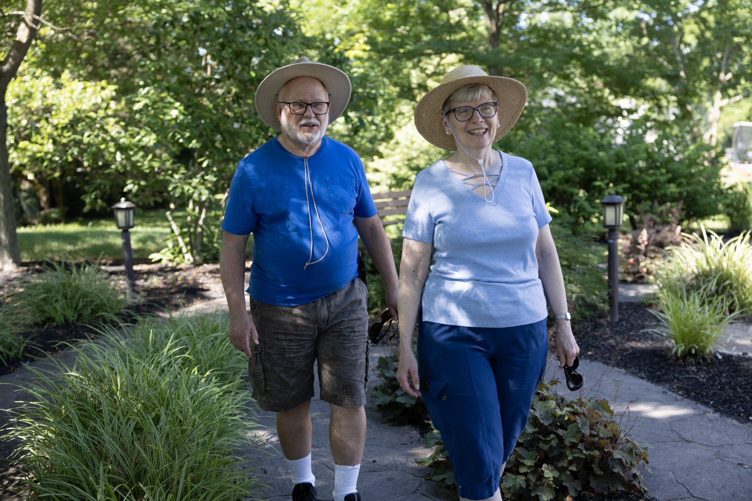 Two retired seniors taking a brisk walk around Peter Becker Community