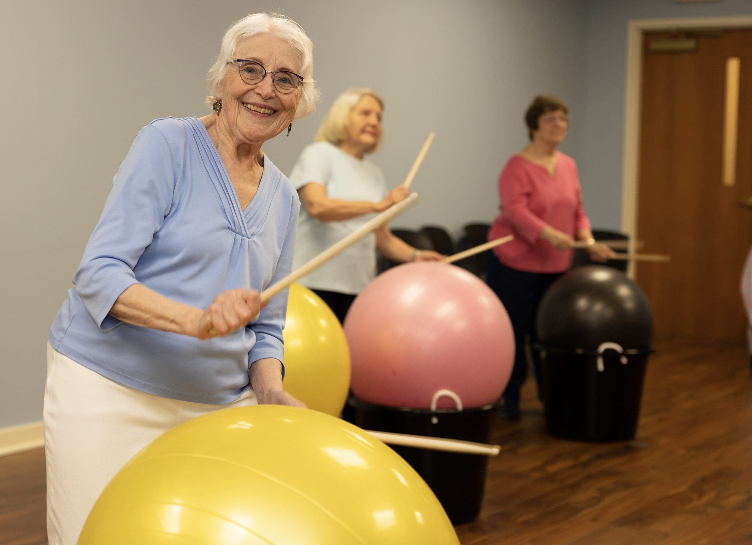 Retired Senior Woman taking page in an exercise class