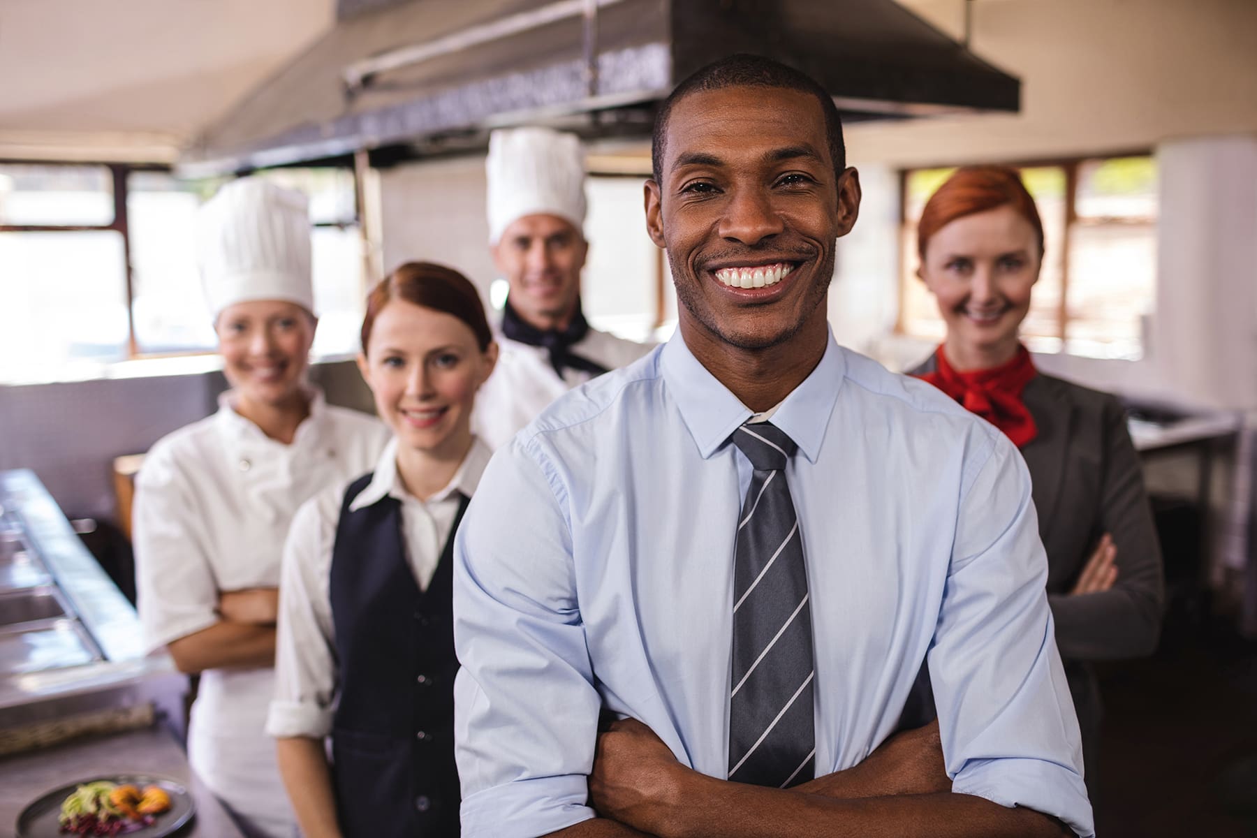 coworkers of various job types smiling posing together