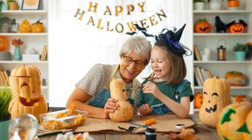 family making fall crafts for seniors