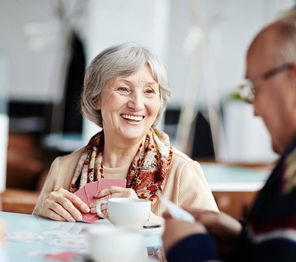Senior Aged Woman Smiling at Male Companion Senior Aged Woman Smiling at Male Companion